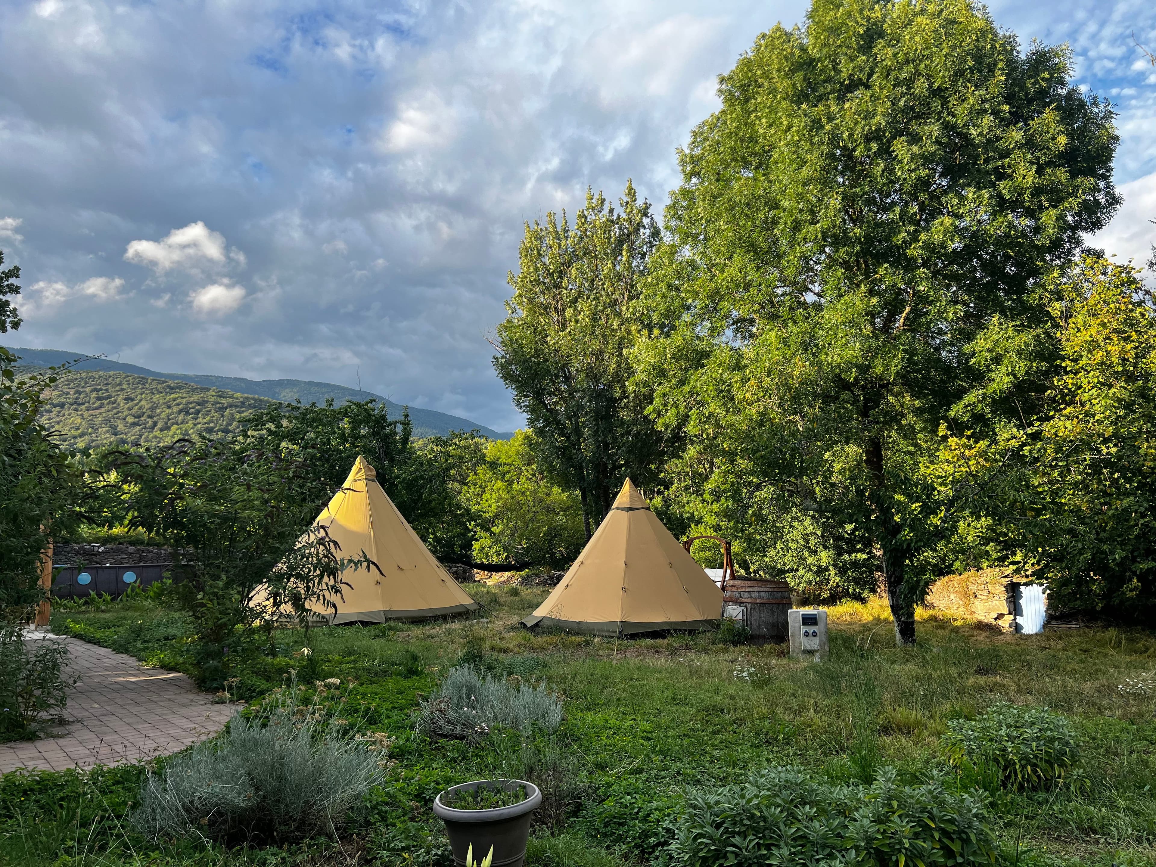 Two tipis with mountain views and garden setting