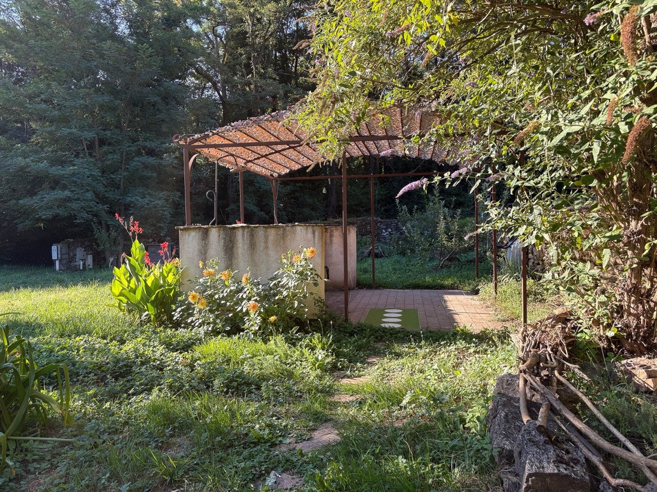 Outdoor shower and garden with mountains