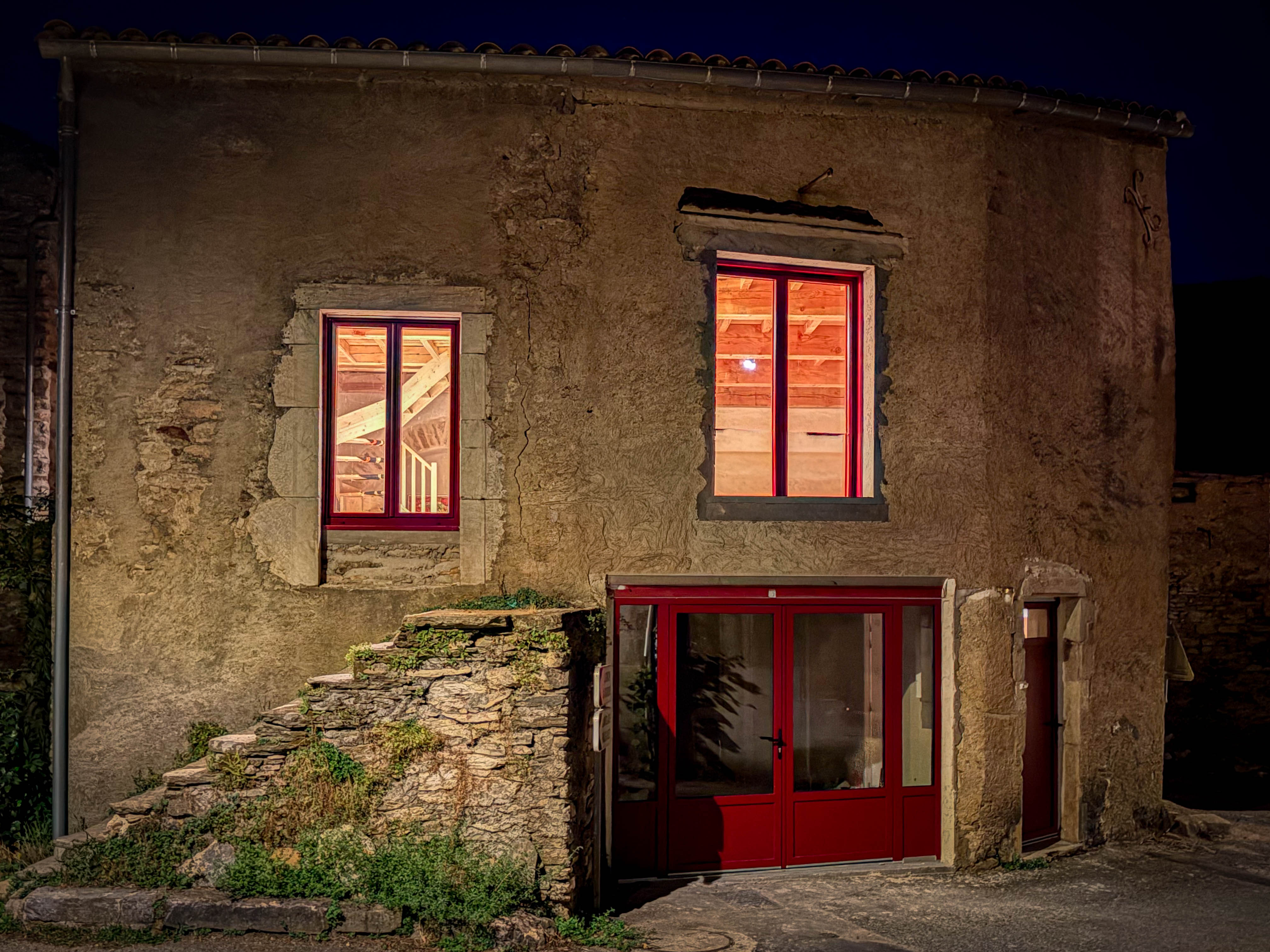Barn facade illuminated at night