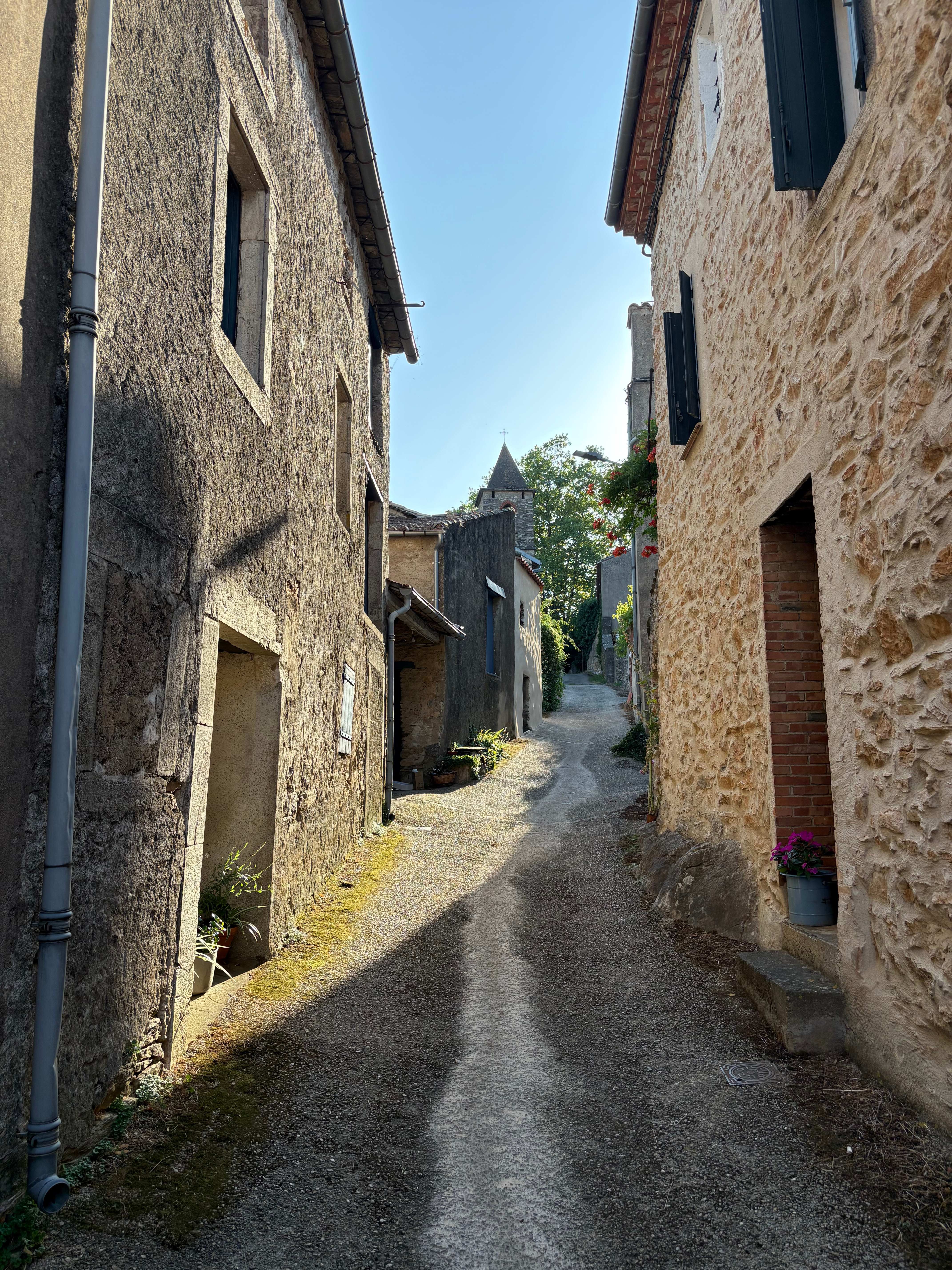 lieu-dit Ardouane Narrow village lane with church steeple