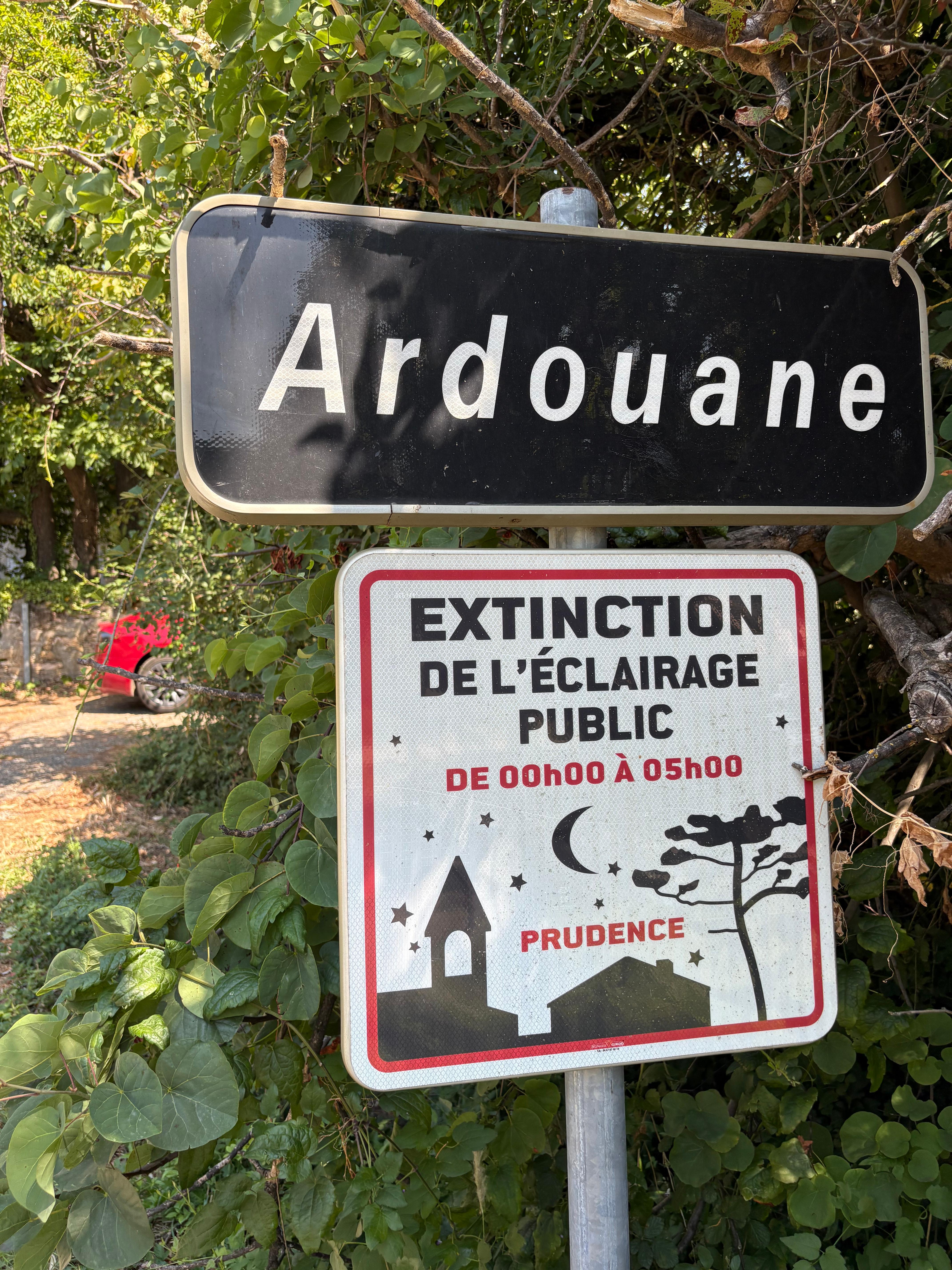 Ardouane dark by night Ardouane village sign with dark sky initiative notice