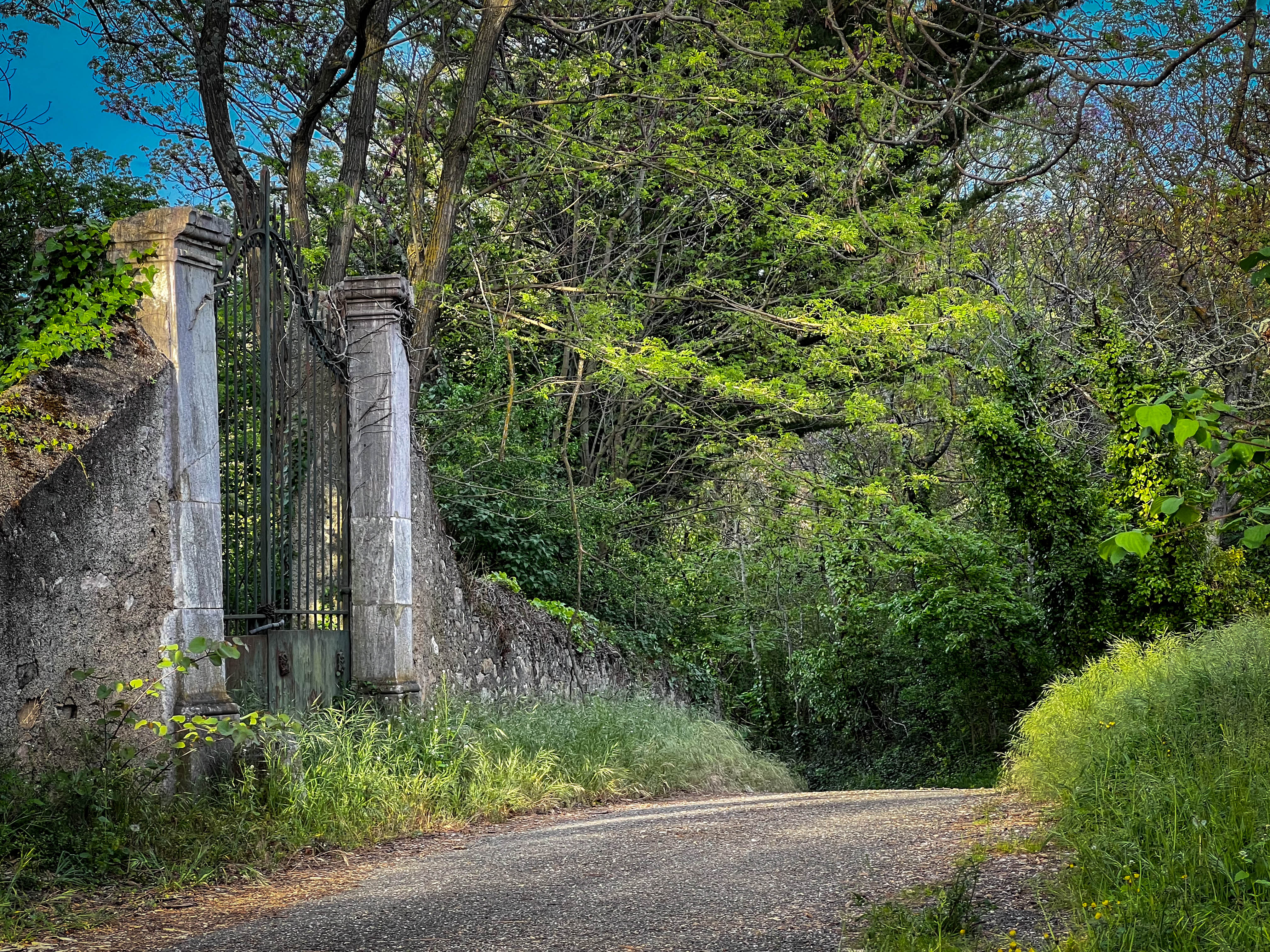Rustic stone gate entrance with weathered pillars