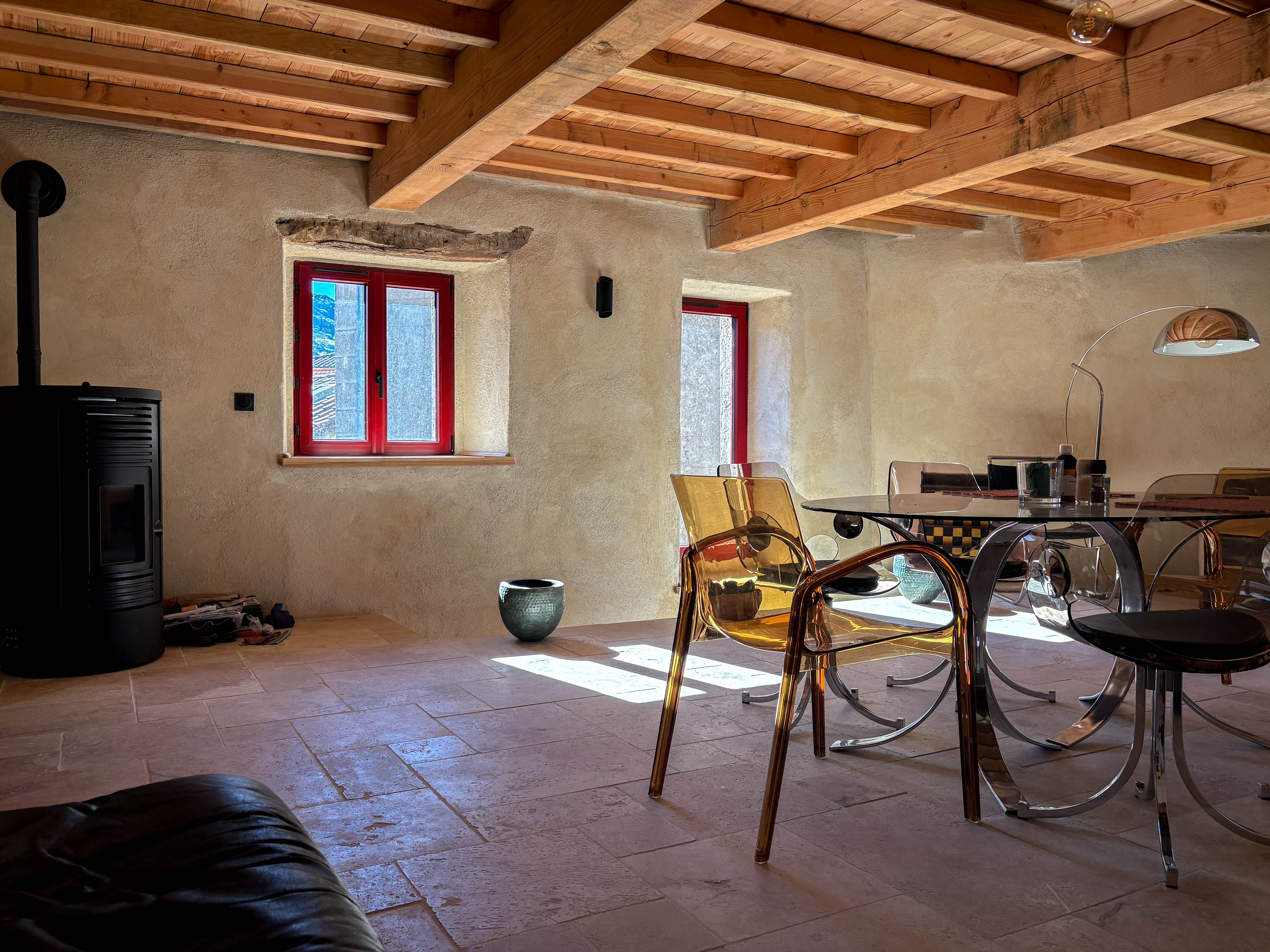 La Funky Barn living room with chalet-style beams