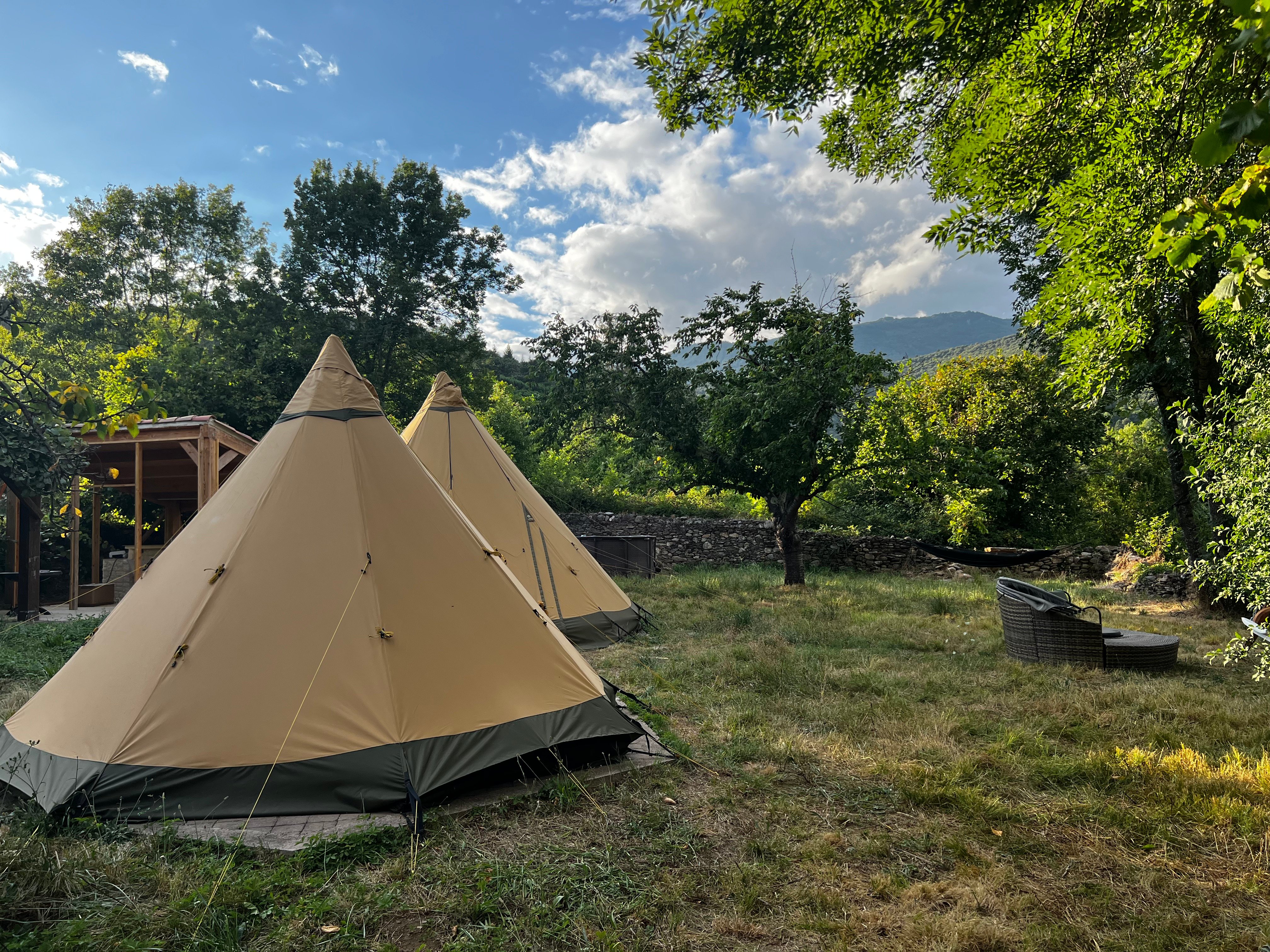 Tipi garden with outdoor kitchen and stone walls